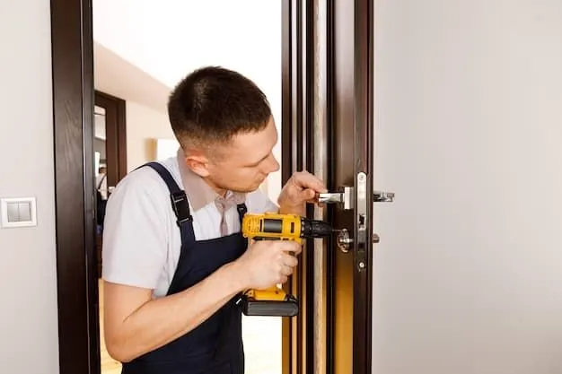Tech drilling new hardware into an interior door